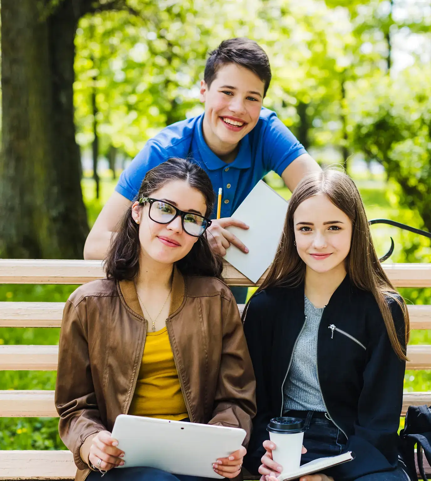 High school students collaborating on SAT Math study outdoors